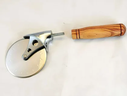 Pizza cutter with stainless steel wheel and alligator-juniper handle, shown disassembled.